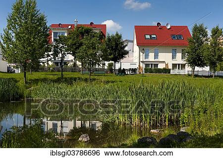 "Semi-detached houses on a lake, Markt Schwaben, Bavaria, Germany, Europe" View Large Photo Image Stock Photograph - "Semi-detached houses on a lake, Markt Schwaben, Bavaria, Germany, Europe". Fotosearch