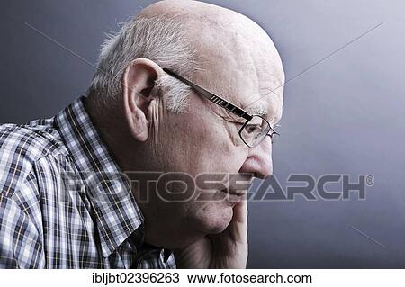 Stock Image - "Senior citizen, elderly man, pensive, portrait". Fotosearch