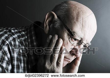 Stock Image - "Senior citizen, elderly man, pensive, portrait". Fotosearch