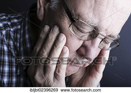 Stock Photo - "Senior citizen, elderly man, tired, portrait". Fotosearch