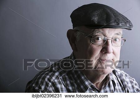 "Senior citizen, elderly man, with a cap and glasses, portrait" View Large Photo Image Stock Image - "Senior citizen, elderly man, with a cap and glasses, portrait". Fotosearch
