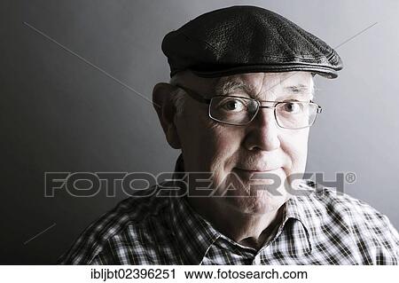 "Senior citizen, elderly man, with a cap and glasses, portrait" View Large Photo Image Stock Image - "Senior citizen, elderly man, with a cap and glasses, portrait". Fotosearch