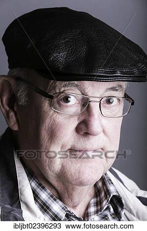 "Senior citizen, elderly man, with a cap and glasses, portrait" View Large Photo Image Stock Image - "Senior citizen, elderly man, with a cap and glasses, portrait". Fotosearch