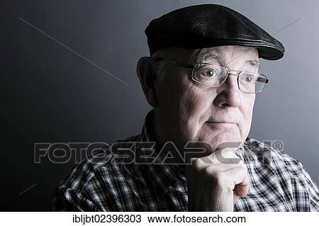 "Senior citizen, elderly man, with a cap and glasses, portrait" View Large Photo Image Stock Image - "Senior citizen, elderly man, with a cap and glasses, portrait". Fotosearch