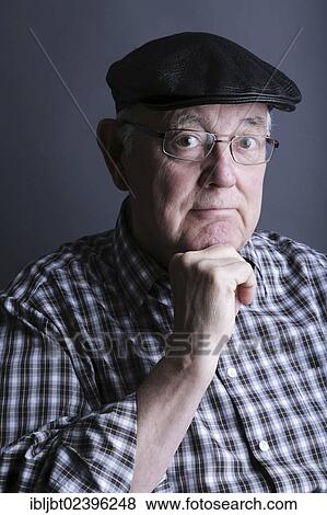 "Senior citizen, elderly man, with a cap and glasses, portrait" View Large Photo Image Stock Photo - "Senior citizen, elderly man, with a cap and glasses, portrait". Fotosearch
