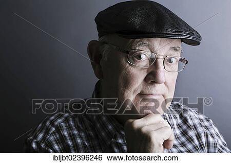 "Senior citizen, elderly man, with a cap and glasses, portrait" View Large Photo Image Stock Photograph - "Senior citizen, elderly man, with a cap and glasses, portrait". Fotosearch