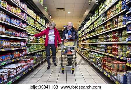 "Senior couple shopping in a supermarket, Germany, Europe" View Large Photo Image Stock Image - "Senior couple shopping in a supermarket, Germany, Europe". Fotosearch