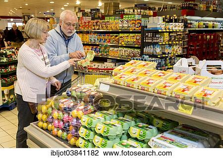"Senior couple shopping in a supermarket, Germany, Europe" View Large Photo Image Stock Image - "Senior couple shopping in a supermarket, Germany, Europe". Fotosearch
