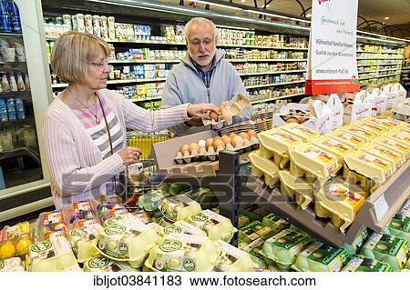 "Senior couple shopping in a supermarket, Germany, Europe" View Large Photo Image Stock Image - "Senior couple shopping in a supermarket, Germany, Europe". Fotosearch