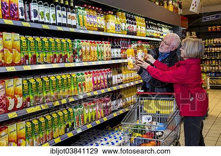 "Senior couple shopping in a supermarket, Germany, Europe" View Large Photo Image Stock Photo - "Senior couple shopping in a supermarket, Germany, Europe". Fotosearch