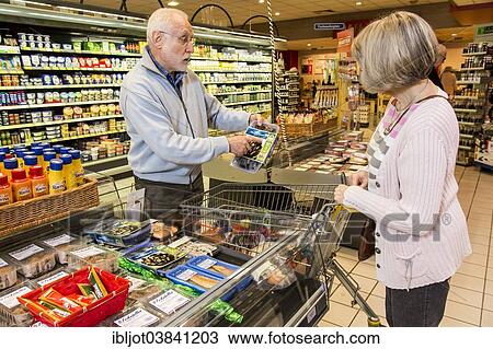 "Senior couple shopping in supermarket, Germany, Europe" View Large Photo Image Stock Image - "Senior couple shopping in supermarket, Germany, Europe". Fotosearch