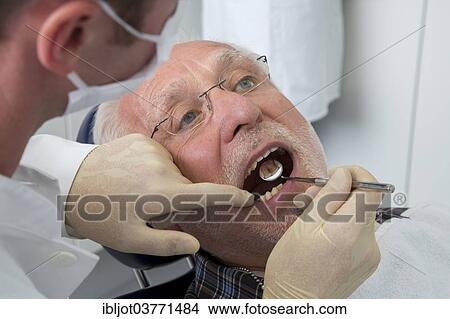 "Senior man at the dentist, Germany, Europe" View Large Photo Image Picture - "Senior man at the dentist, Germany, Europe". Fotosearch