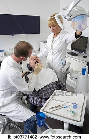 Stock Image - "Senior man at the dentist, Germany, Europe". Fotosearch