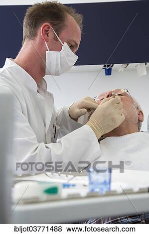 "Senior man at the dentist, Germany, Europe" View Large Photo Image Stock Photo - "Senior man at the dentist, Germany, Europe". Fotosearch