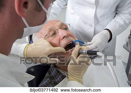 "Senior man receiving treatment at the dentist, Germany, Europe" View Large Photo Image Stock Image - "Senior man receiving treatment at the dentist, Germany, Europe". Fotosearch