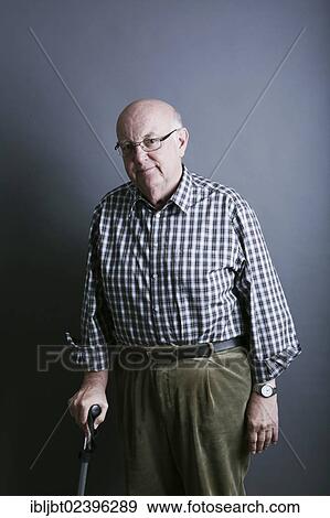 Stock Photo - Senior with a walking stick. Fotosearch