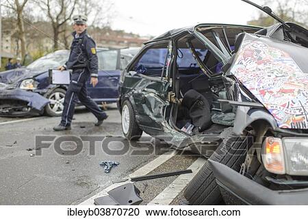 "Serious accident, a VW Polo and a VW Touran collided in oncoming traffic, car wrecks in the street, police officer, B14 road at Neckartor, Stuttgart, Baden-Wurttemberg, Germany, Europe" View Large Photo Image Stock Image - "Serious accident, a VW Polo and a VW Touran collided in oncoming traffic, car wrecks in the street, police officer, B14 road at Neckartor, Stuttgart, Baden-Wurttemberg, Germany, Europe". Fotosearch