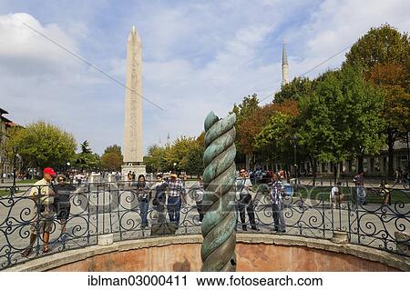 Stock Image - "Serpentine Column, in the rear the Obelisk of Thutmosis III, Hippodrome or At Meydani square, Istanbul, European side, Istanbul Province, Turkey, European side, Europe". Fotosearch
