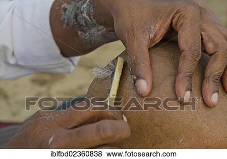"Shaving head and beard as part of the ritual to pray farewell for the soul of a deceased person, at the ghats of Varanasi, India, Asia" View Large Photo Image Stock Photo - "Shaving head and beard as part of the ritual to pray farewell for the soul of a deceased person, at the ghats of Varanasi, India, Asia". Fotosearch