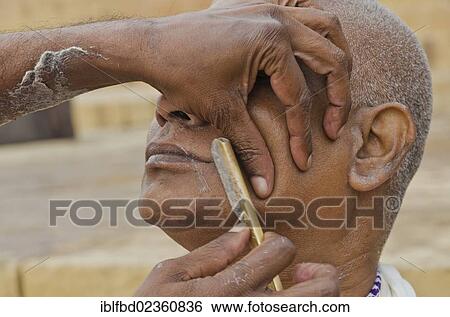 "Shaving head and beard as part of the ritual to pray farewell for the soul of a deceased person, at the ghats of Varanasi, India, Asia" View Large Photo Image Stock Photograph - "Shaving head and beard as part of the ritual to pray farewell for the soul of a deceased person, at the ghats of Varanasi, India, Asia". Fotosearch