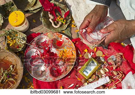 "Shell cone, bell, colourpowder and other small items to work with as a priest, hands holding some notes, Kathmandu, Kathmandu District, Bagmati Zone, Nepal, Asia" View Large Photo Image Stock Image - "Shell cone, bell, colourpowder and other small items to work with as a priest, hands holding some notes, Kathmandu, Kathmandu District, Bagmati Zone, Nepal, Asia". Fotosearch