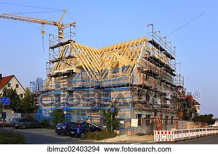 "Shell of a multistory apartment building with finished roof and construction crane, Eckental, Middle Franconia, Bavaria, Germany Europe, PublicGround" View Large Photo Image Picture - "Shell of a multistory apartment building with finished roof and construction crane, Eckental, Middle Franconia, Bavaria, Germany Europe, PublicGround". Fotosearch