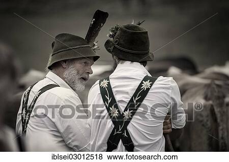 "Shepherds in front of a herd of cattle during the Viehscheid cattle drive, Gunzesried, Allgau, Bavaria, Germany, Europe" View Large Photo Image Stock Photo - "Shepherds in front of a herd of cattle during the Viehscheid cattle drive, Gunzesried, Allgau, Bavaria, Germany, Europe". Fotosearch