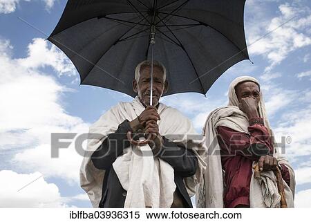 "Shepherds protect themselves with an umbrella from the scorching sun, Tigray, Ethiopia, Africa" View Large Photo Image Stock Photography - "Shepherds protect themselves with an umbrella from the scorching sun, Tigray, Ethiopia, Africa". Fotosearch
