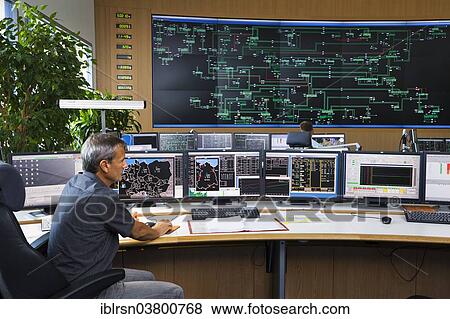 "Shift supervisor Hans-Peter Polzer sitting at his work station in the Transmission Control Center, TCC, of transmission network operator 50Hertz, Neuenhagen, Brandenburg, Germany, Europe" View Large Photo Image Stock Photo - "Shift supervisor Hans-Peter Polzer sitting at his work station in the Transmission Control Center, TCC, of transmission network operator 50Hertz, Neuenhagen, Brandenburg, Germany, Europe". Fotosearch