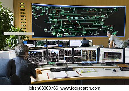 "Shift supervisor Hans-Peter Polzer sitting at his work station in the Transmission Control Center, TCC, of transmission network operator 50Hertz, Neuenhagen, Brandenburg, Germany, Europe" View Large Photo Image Stock Photograph - "Shift supervisor Hans-Peter Polzer sitting at his work station in the Transmission Control Center, TCC, of transmission network operator 50Hertz, Neuenhagen, Brandenburg, Germany, Europe". Fotosearch