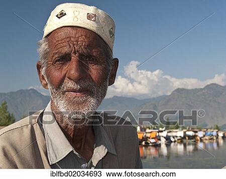 "Shikara driver waiting for clients, Shikara, traditional boat on Dal Lake, Srinagar, Jammu and Kashmir, India, Asia" View Large Photo Image Stock Image - "Shikara driver waiting for clients, Shikara, traditional boat on Dal Lake, Srinagar, Jammu and Kashmir, India, Asia". Fotosearch