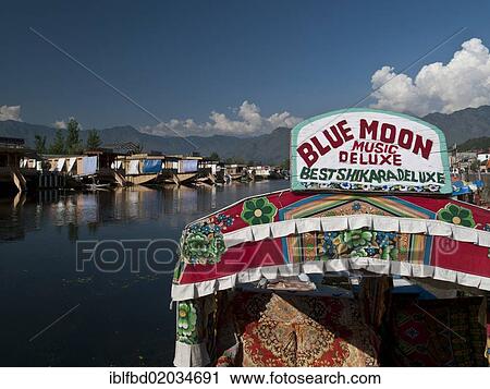 Stock Image - "Shikara, traditional boat on Dal Lake, Srinagar, Jammu and Kashmir, India, Asia". Fotosearch