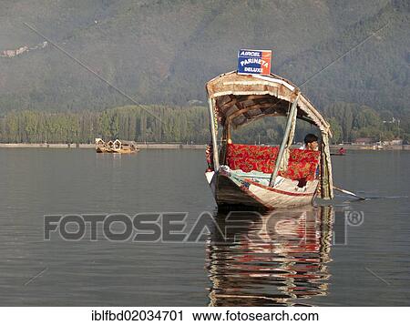 Stock Image - "Shikara, traditional boat on Dal Lake, Srinagar, Jammu and Kashmir, India, Asia". Fotosearch