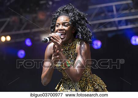 "Shingai Shoniwa, lead singer of British band """"Noisettes"""" performing live at Heitere Open Air, Zofingen, Canton of Aargau, Switzerland, Europe" View Large Photo Image Stock Photo - "Shingai Shoniwa, lead singer of British band """"Noisettes"""" performing live at Heitere Open Air, Zofingen, Canton of Aargau, Switzerland, Europe". Fotosearch