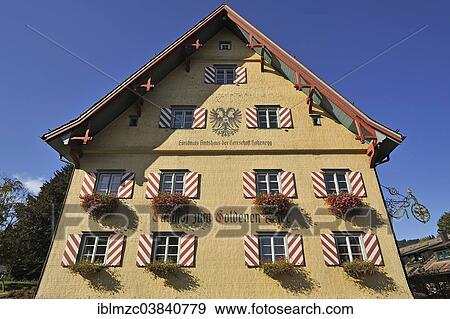 "Shingle facade with windows and flower boxes, of the restaurant """"Zum Golden Adler"""", Weitnau, Oberallgau, Allgau, Bavaria, Germany, Europe" View Large Photo Image Stock Photo - "Shingle facade with windows and flower boxes, of the restaurant """"Zum Golden Adler"""", Weitnau, Oberallgau, Allgau, Bavaria, Germany, Europe". Fotosearch