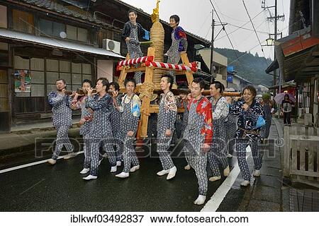 "Shinto festival, Matsuri, in which self-made fireworks wrapped with straw ropes are carried by the approaching darkness on a stage through the town so the residents can donate rice wine, sake, ÅŒno, Aichi Prefecture, Japan, Asia" View Large Photo Image Stock Photo - "Shinto festival, Matsuri, in which self-made fireworks wrapped with straw ropes are carried by the approaching darkness on a stage through the town so the residents can donate rice wine, sake, ÅŒno, Aichi Prefecture, Japan, Asia". Fotosearch