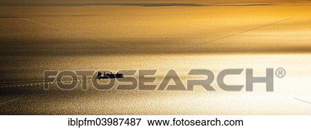 Stock Photo - "Ship and sunset on the Mediterranean Sea, Capri, Campania, Italy, Europe". Fotosearch