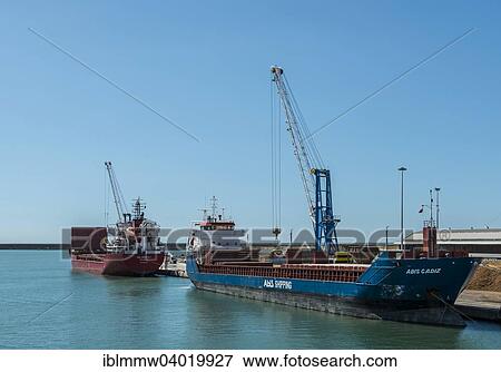 Stock Photo - "Ship being loaded with coal, cargo port of Livorno, Tuscany, Italy, Europe". Fotosearch