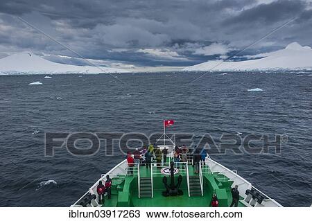 "Ship heading towards glaciers and dark clouds, near Port Lockroy, Wiencke, Palmer Archipelago, Antarctica" View Large Photo Image Stock Image - "Ship heading towards glaciers and dark clouds, near Port Lockroy, Wiencke, Palmer Archipelago, Antarctica". Fotosearch