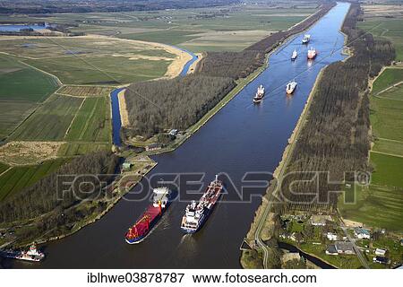 "Ship traffic on the Kiel Canal or Nord-Ostsee-Kanal, Brunsbuttel, Schleswig-Holstein, Germany, Europe" View Large Photo Image Stock Photo - "Ship traffic on the Kiel Canal or Nord-Ostsee-Kanal, Brunsbuttel, Schleswig-Holstein, Germany, Europe". Fotosearch