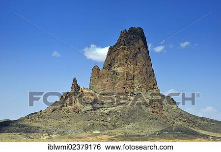 Stock Photograph - "Shiprock Monolith, sacred mountain of the Navajo Indians, en route to Monument Valley, Navajo Tribal Park, Navajo Nation Reservation, Arizona, Southwestern USA, Utah, USA". Fotosearch