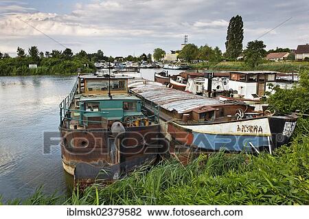 Stock Image - "Shipyard in the large dock, the former Gare d'Eau, Saint-Jean-de-Losne, Dijon, Burgundy region, department of Cote d'Or, France, Europe". Fotosearch