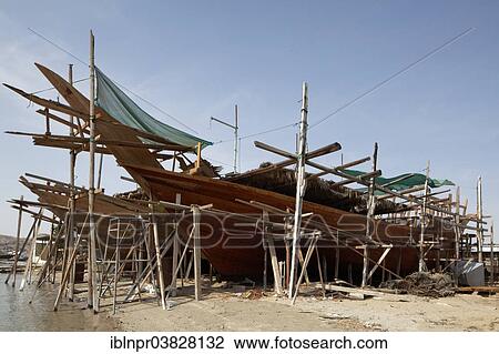 "Shipyard with an old dhow-ship being repaired, Sur, Ash Sharqiyah province, Sultanate of Oman, Arabian Peninsula" View Large Photo Image Stock Image - "Shipyard with an old dhow-ship being repaired, Sur, Ash Sharqiyah province, Sultanate of Oman, Arabian Peninsula". Fotosearch