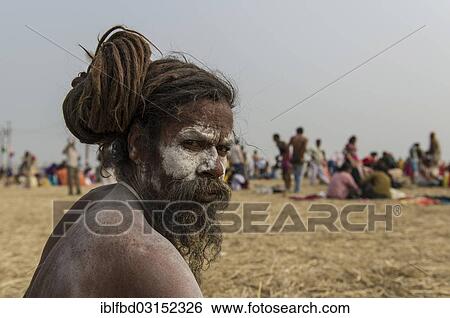 Stock Photograph - "Shiva sadhu, holy man, at the Sangam, the confluence of the rivers Ganges, Yamuna and Saraswati, during Kumbha Mela festival, Allahabad, Uttar Pradesh, India, Asia". Fotosearch
