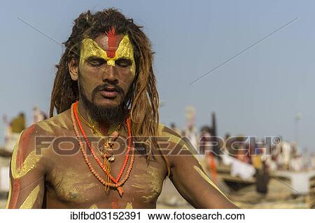 Stock Image - "Shiva sadhu, holy man, meditating at the Sangam, the confluence of the rivers Ganges, Yamuna and Saraswati, during Kumbha Mela festival, Allahabad, Uttar Pradesh, India, Asia". Fotosearch