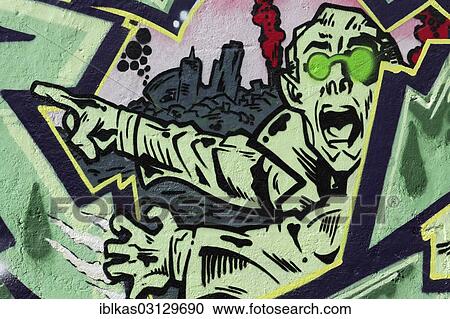 Stock Image - "Shocked man pointing with his finger, graffiti, Meiderich, Duisburg, Ruhr district, North Rhine-Westphalia, Germany, Europe". Fotosearch