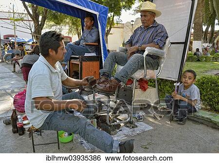 "Shoeshine boy at work, Tlacolula, Oaxaca State, Mexico, North America" View Large Photo Image Stock Photograph - "Shoeshine boy at work, Tlacolula, Oaxaca State, Mexico, North America". Fotosearch
