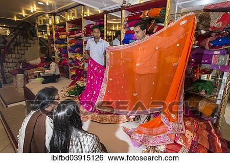 "Shop assistants presenting colorful saris to customers, Jaipur, Rajasthan, India, Asia" View Large Photo Image Stock Photograph - "Shop assistants presenting colorful saris to customers, Jaipur, Rajasthan, India, Asia". Fotosearch