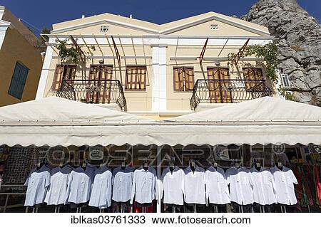 "Shop selling shirts, Symi, Symi Island, Dodecanese, Greece, Europe" View Large Photo Image Stock Image - "Shop selling shirts, Symi, Symi Island, Dodecanese, Greece, Europe". Fotosearch