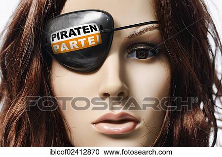 Stock Image - Shop-window mannequin wearing an eye patch with the logo of the Pirate Party of Germany. Fotosearch